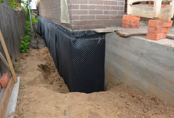 Happy homeowners after waterproofing job in Watson
